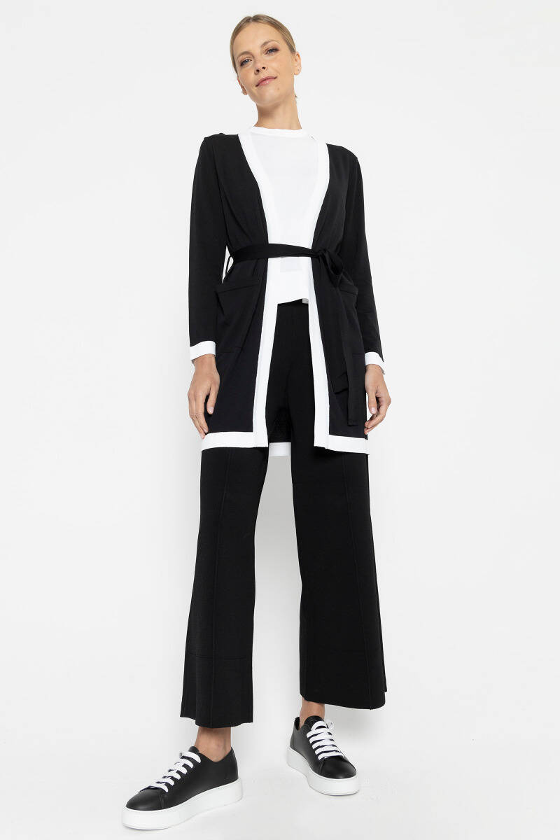 Czarny kardigan z białymi lamówkami